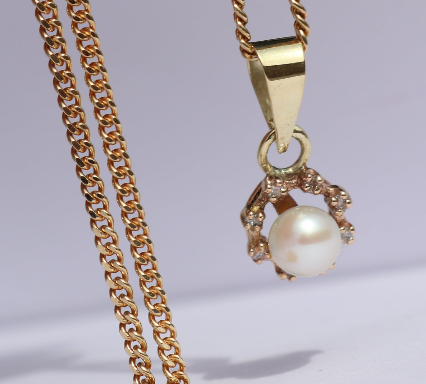 SOLD 14 kt gold pendant with pearl and diamond on a 14 kt gold necklace