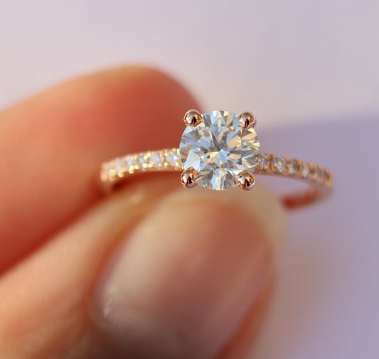 14 kt gouden ring gezet met 1.17 ct diamanten, centrale 0.91 ct. SI1 -F top wit