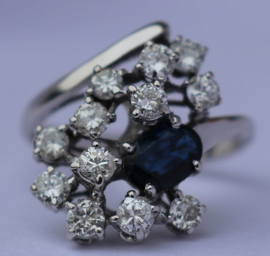 14 kt gouden ring met saffier en 1.20 ct diamanten